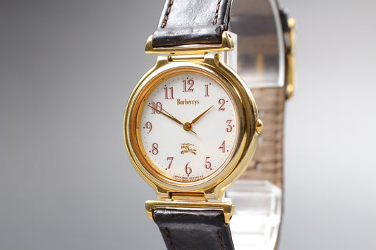 N MINT Burberrys 2830-266536Y White Dial Gold Quartz 31mm Unisex Watch JAPAN